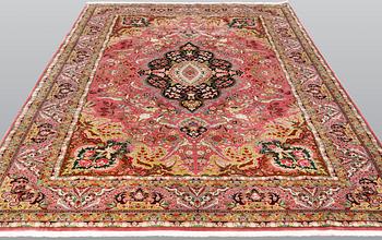 A Tabriz carpet, part silk, 50 Raj count, c. 290 x 200 cm.