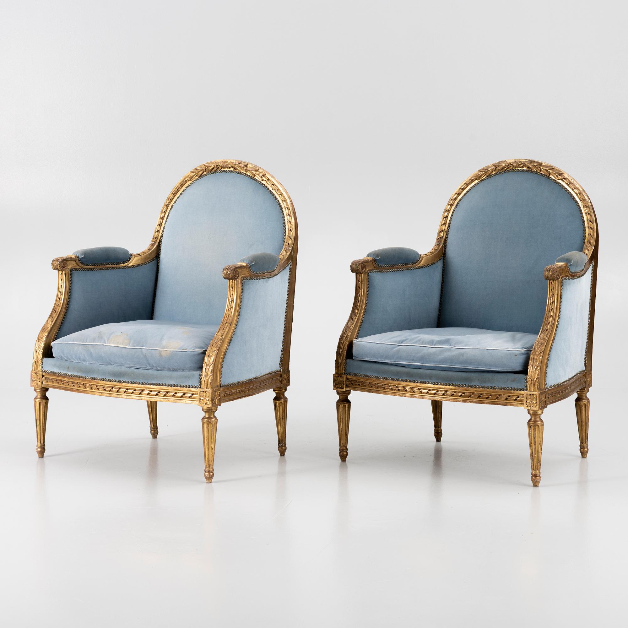 A pair of easy chairs, Louis XVI style, 20th century.
