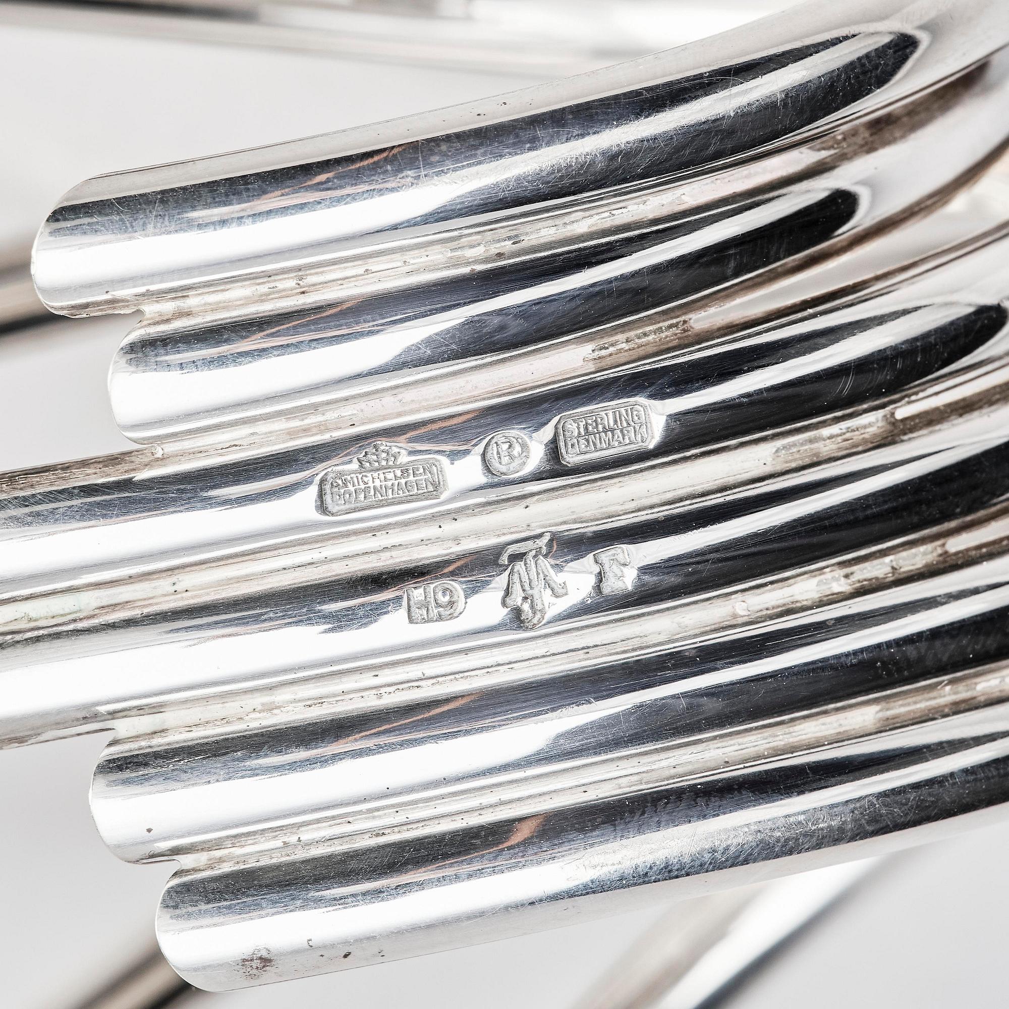 Ibi Trier Mørch, a pair of "Bølgeslag" six-branched sterling silver candelabra for A. Michelsen, Denmark 1951.