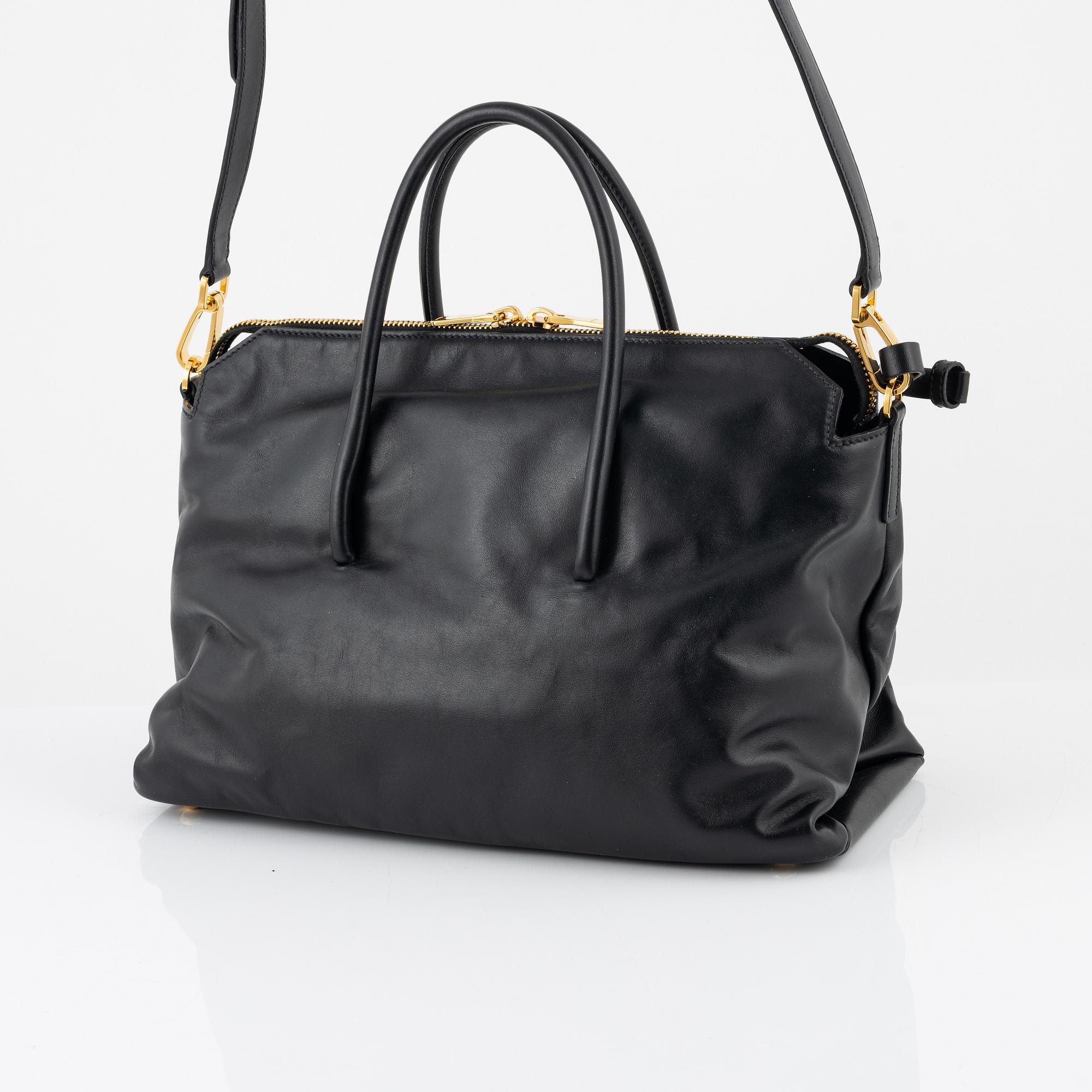 Miu Miu, a black leather handbag.