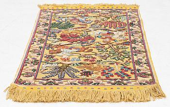 An old oriental rug, soul, figural, c. 106 x 74 cm.