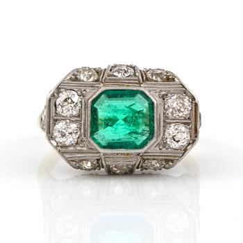 An Art deco, circa 0.70 ct, emerald and 1.00 ct old-cut diamond ring.