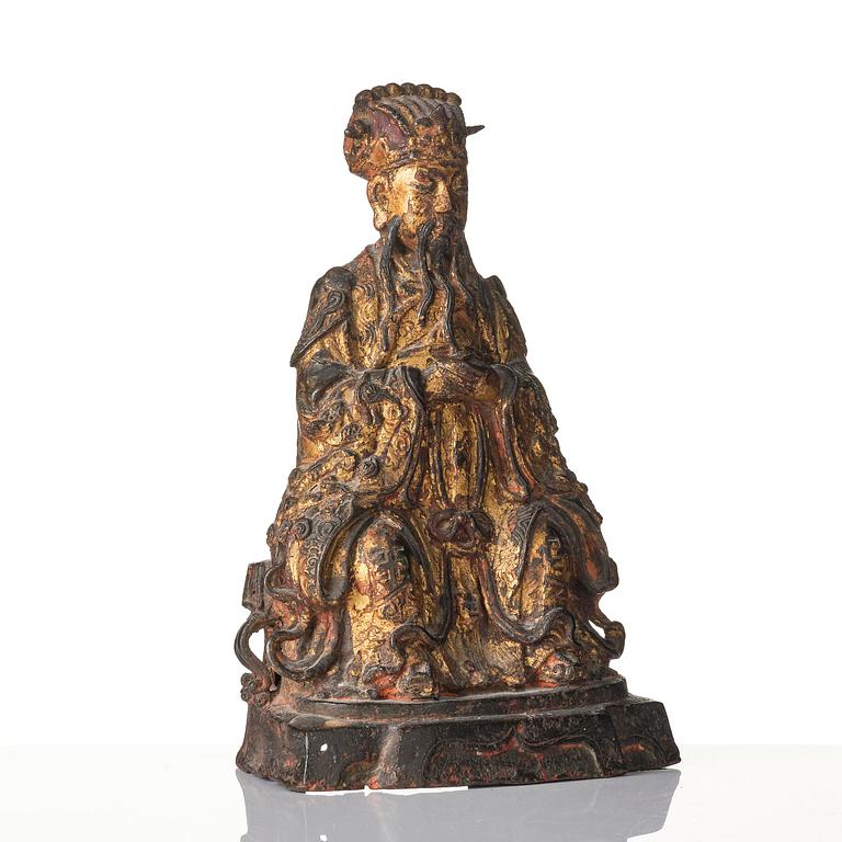 A Chinese gilt lacquered figure of a daoist deity, Ming dynasty (1368-1644).