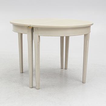 A Gustaivan style dining table/ two crescent shaped tables, end of the 19th century.