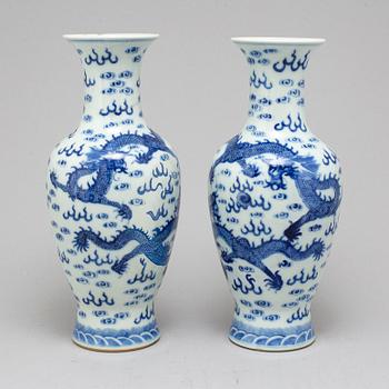 A pair of Chinese blue and white dragon vases, early 20th century, with a Qianlong mark.