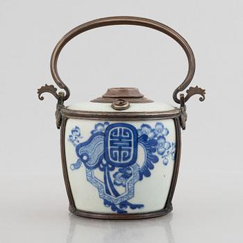 A metal mounted porcelain ewer, late Qing dynasty.
