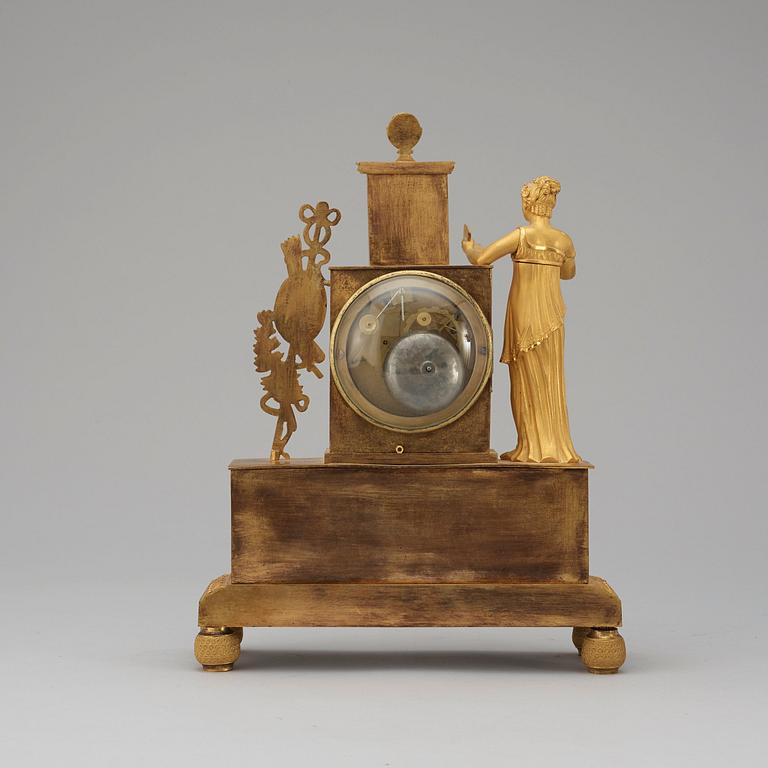 A French Empire early 19th century gilt bronze mantel clock.