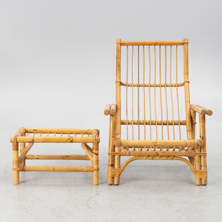 An easy chair with foot stool, end of the 20th century.