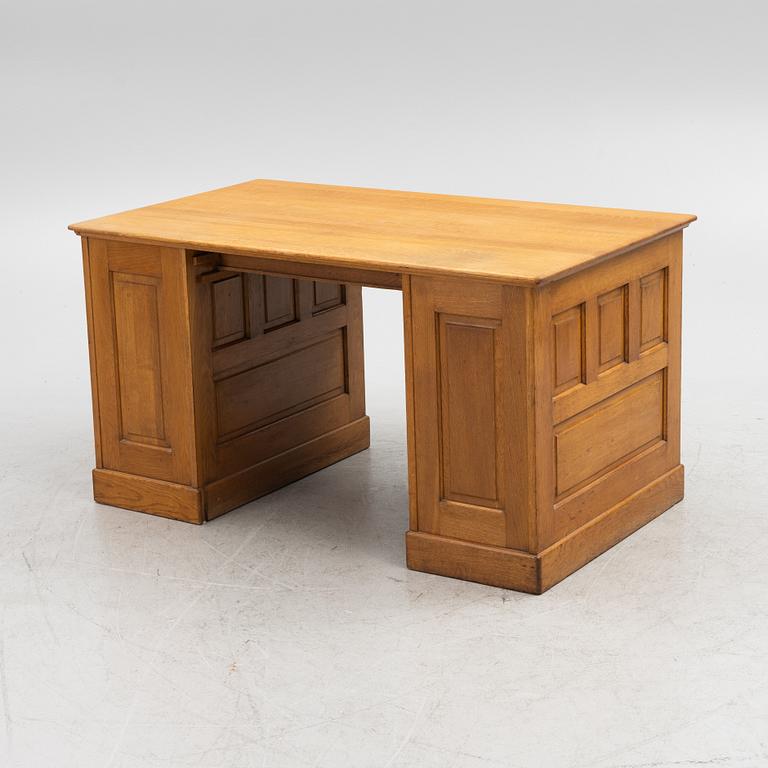 An oak writngdesk with a chair from Åtvidabergs, first part of the 20th century.