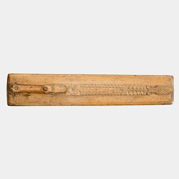 A Swedish folk art mangle board with carved decorationd, owners' initials and the date 1744.