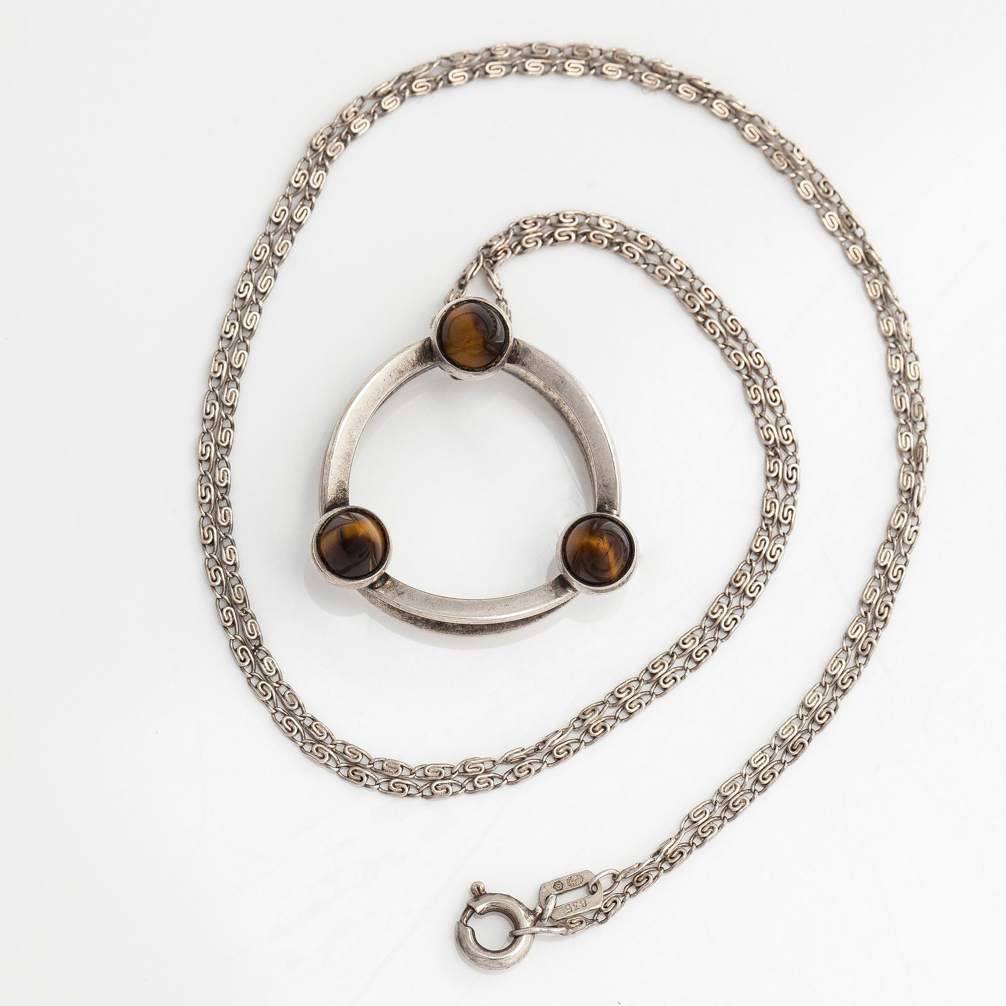 Elis Kauppi, a silver and tiger's eye pendant, Kupittaan Kulta, Turku. With chain in silver.