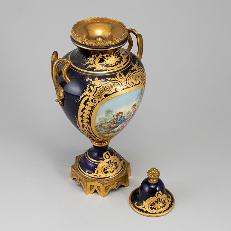 A French porcelain and gilt bronze urn with cover, 20th century.