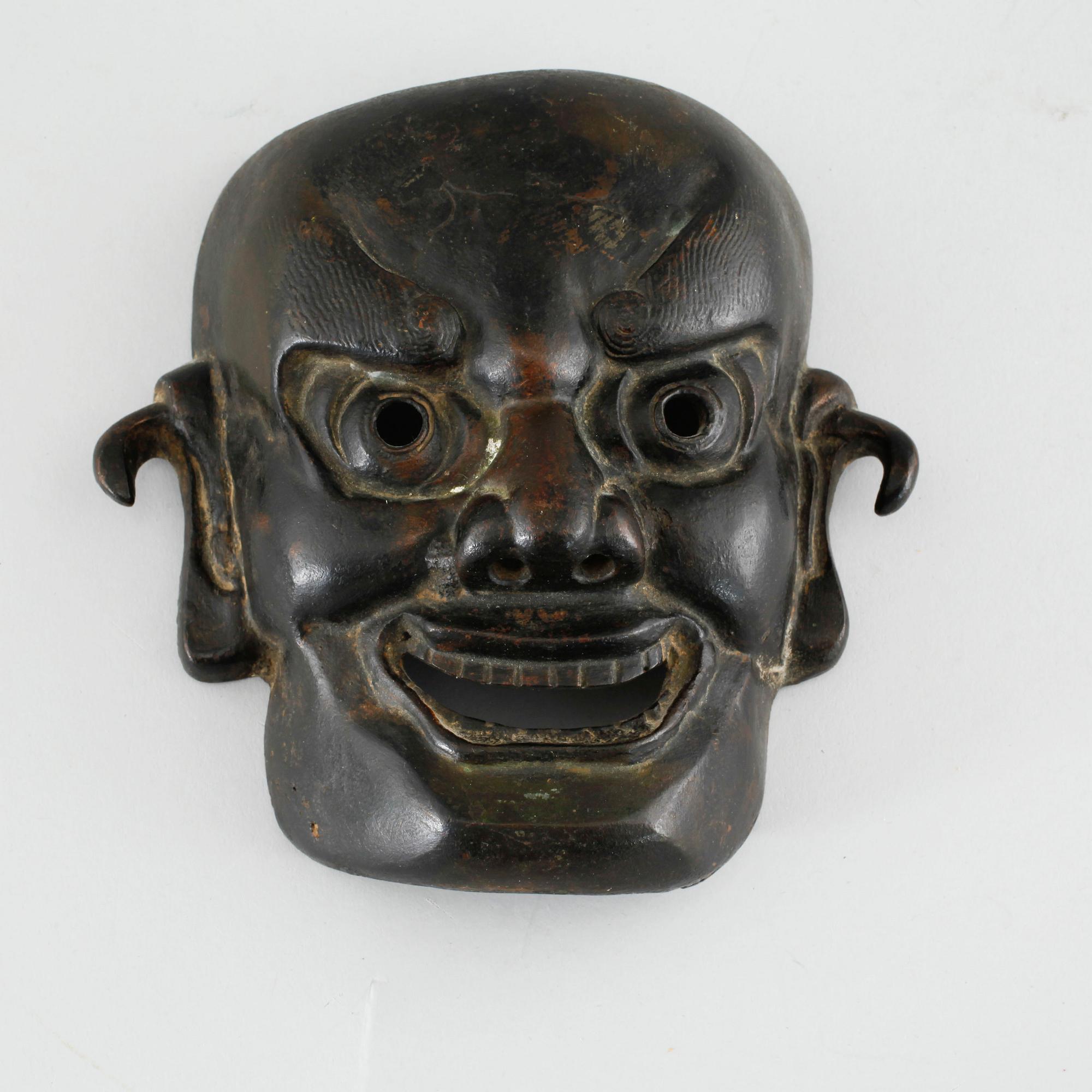 A bronze mask from Japan, Meiji (1868- 1912).