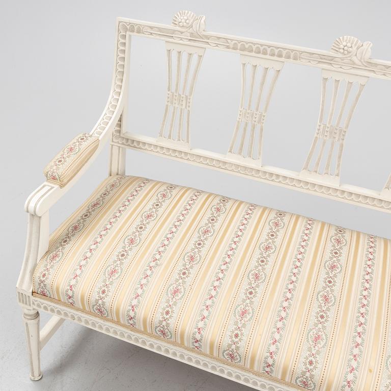 A sofa, three chairs and a table, Gustaivan style and of the Gustavian period, 19th-20th century.