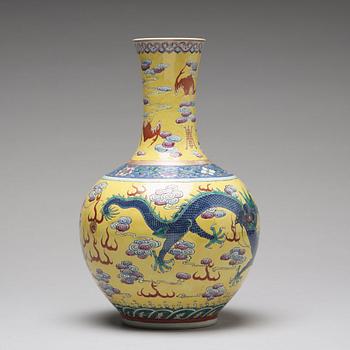 A yellow glazed five clawed dragon vase, probably late Qing dynasty with Guangxus mark.