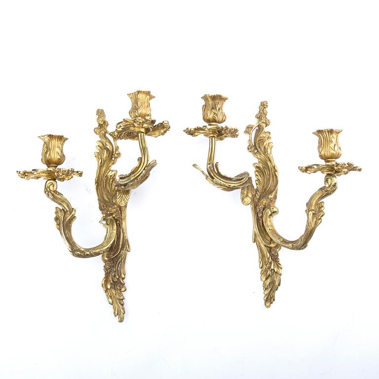 A pair of Rococo style gilded wall scones late 19th century-early 20th century.