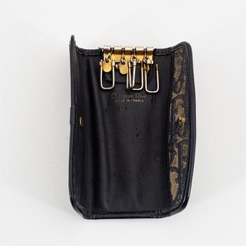 Christian Dior, a canvas handbag, toilet bag and key holder.