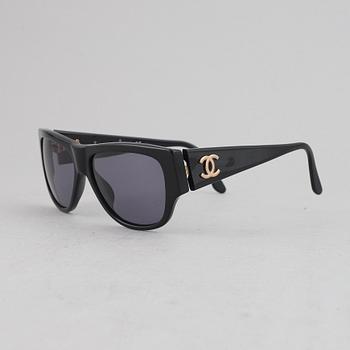 Chanel, a pair of sunglasses.