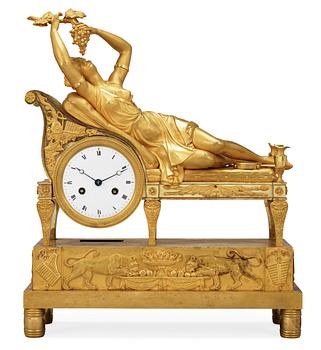 660. A French Empire early 19th Century mantel clock.
