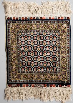 Four silk rugs/pads, probably Hereke, ca 33 x 33 cm.