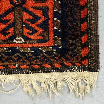 A rug, a semi-antique Baluch, ca 166 x 92 cm.