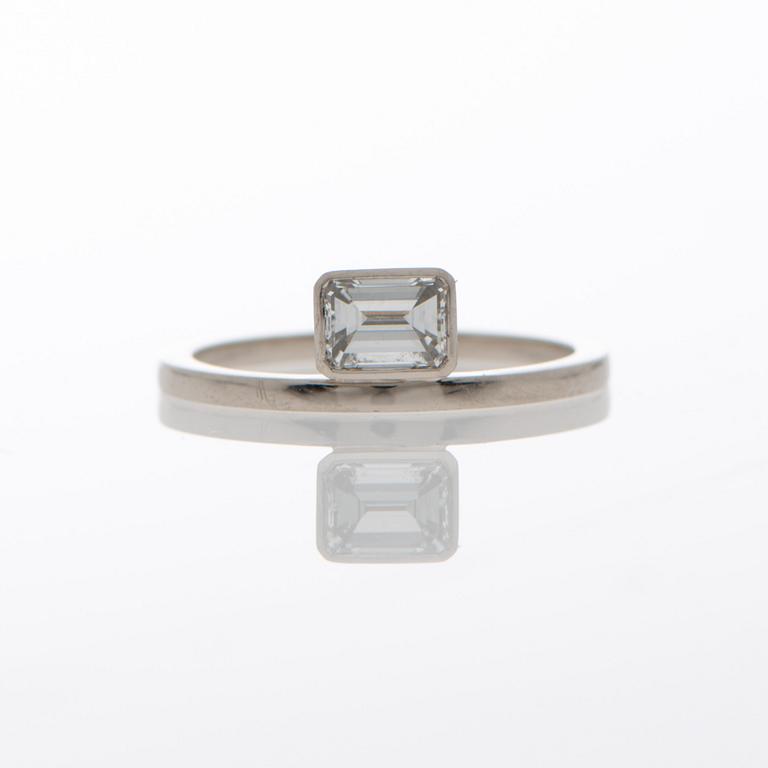 A RING, emerald cut diamond, 14K white gold.