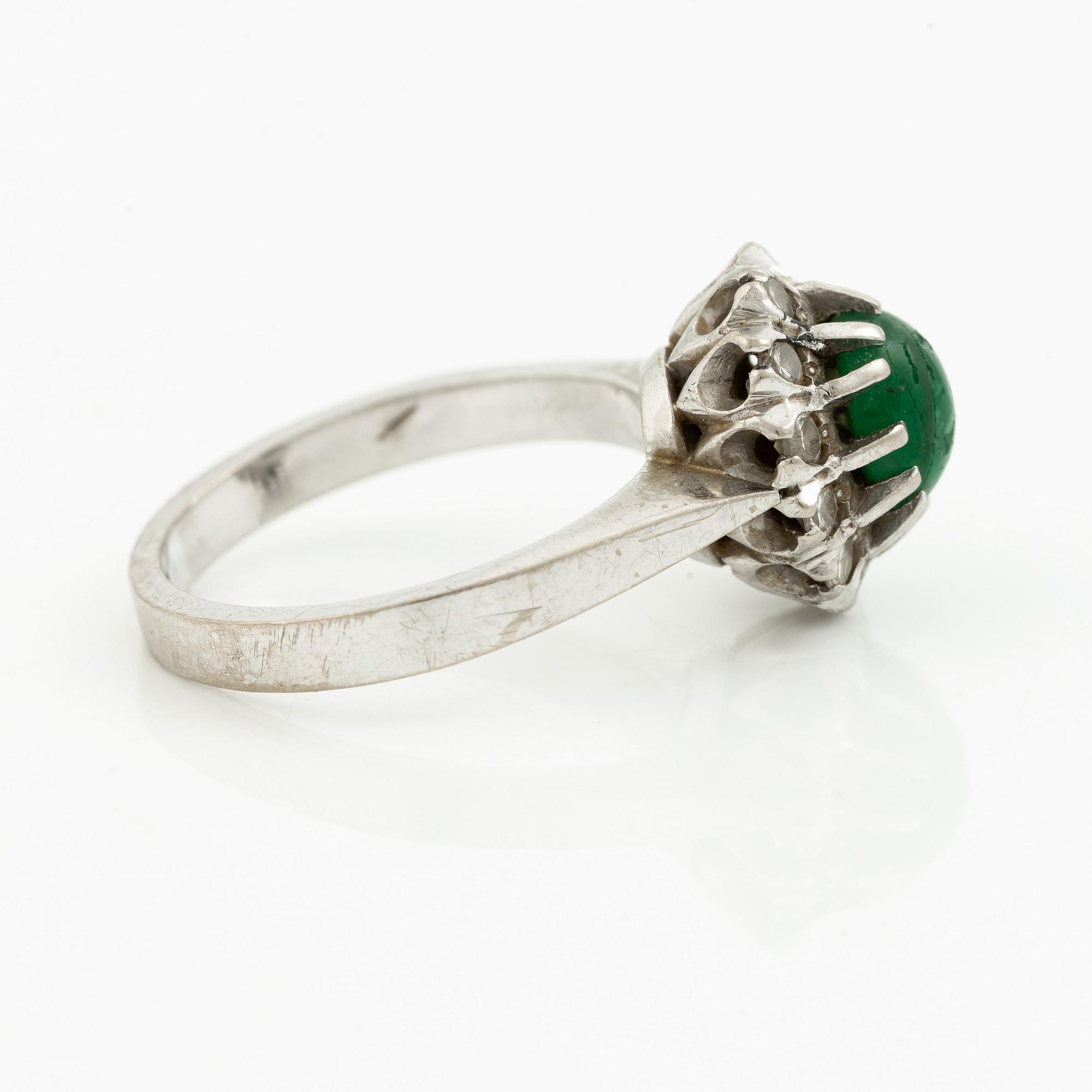 Ring, 18K white gold with cabochon-cut emerald and brilliant-cut diamonds.
