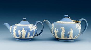 1262. Two English jasper ware teapots with covers, Wedgwood. (2).
