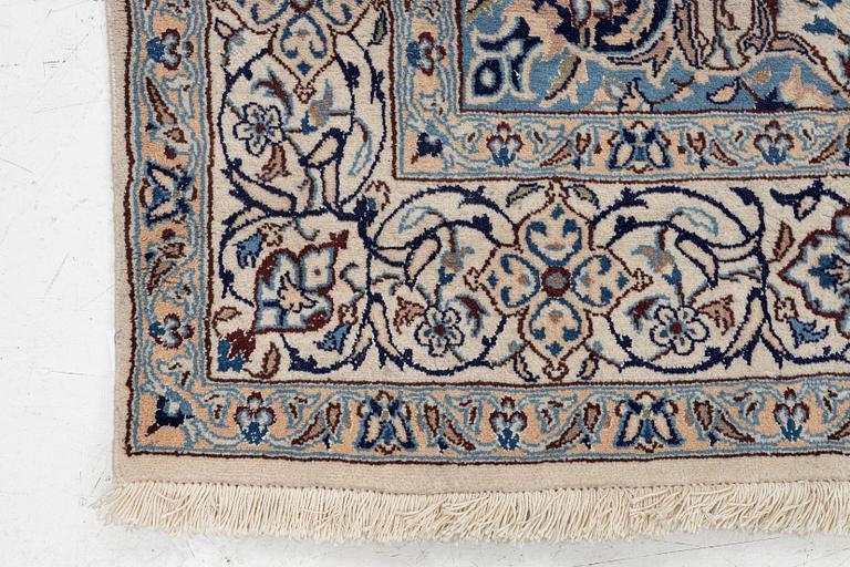 A Nain carpet, c. 310 x 195 cm.