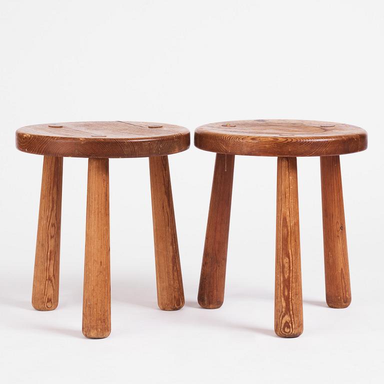 Axel Einar Hjorth, a pair of "Skoga" stained pine stools, Nordiska Kompaniet 1930s.