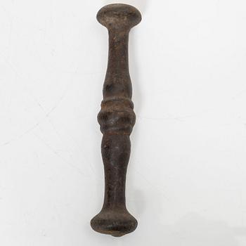 A cast-iron mortar and pestle of renaissance-type, 17th century.