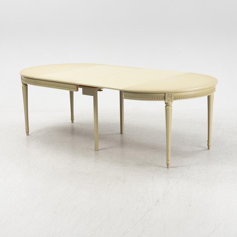 A Gustavian dining table with six chairs. Åmells dated 1974.