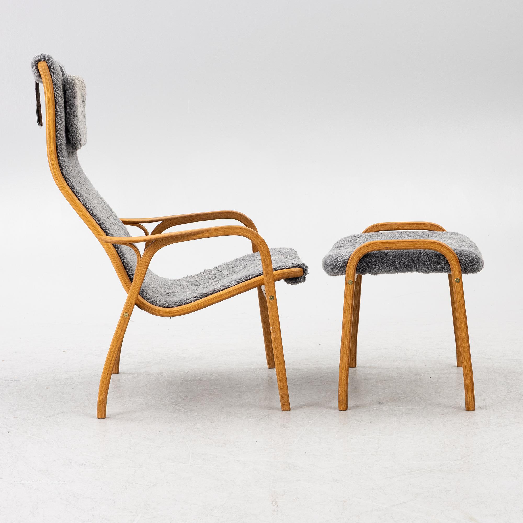 Yngve Ekström, a 'Lamino' armchair with ottoman, Swedese, Sweden, 2018.