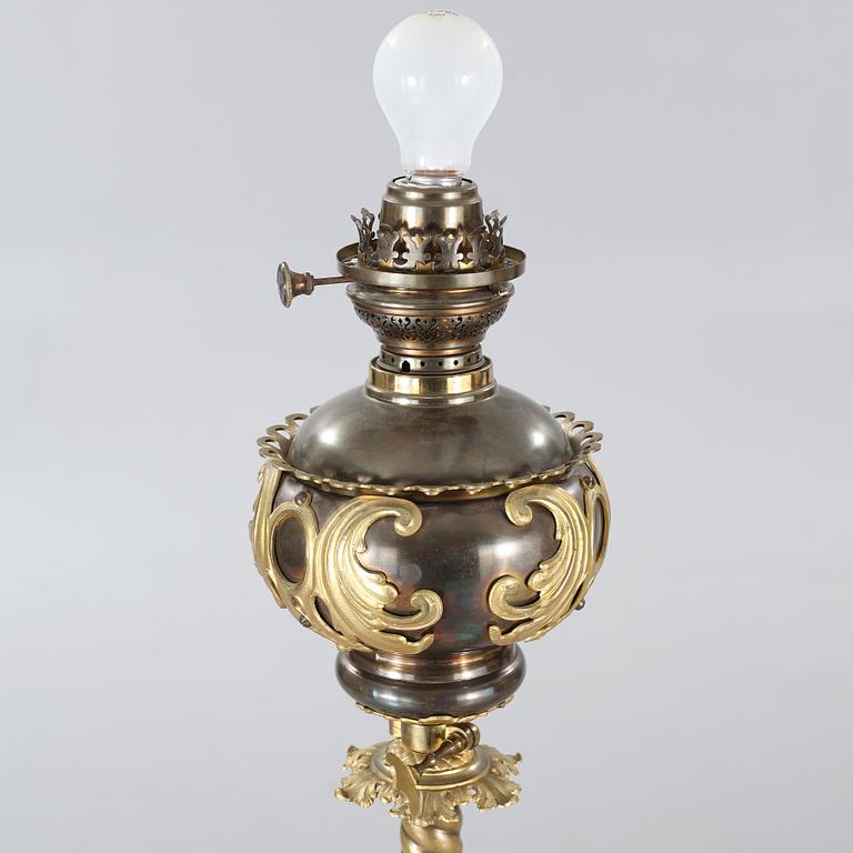 Two floor parafine lamps, 20th century.