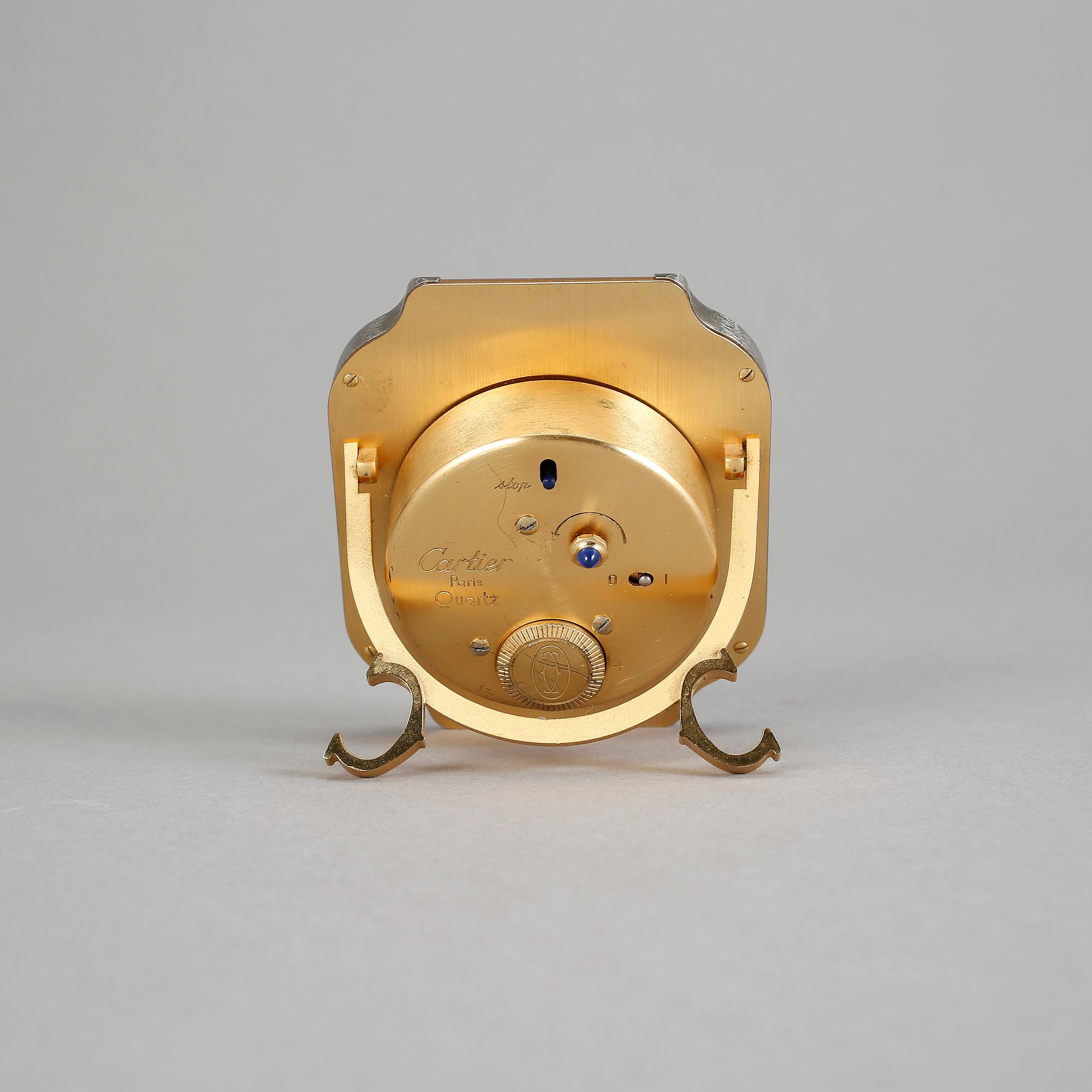 VÄCKARKLOCKA, guld och stål, Cartier.