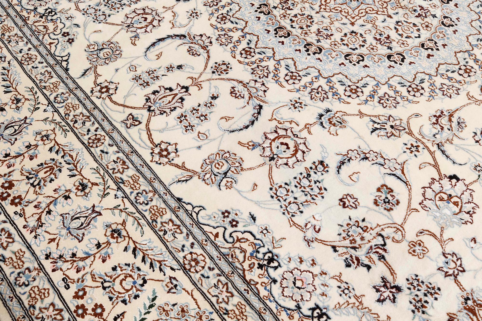 A Nain part-silk carpet, 395 x 293 cm.