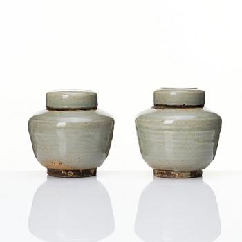 A pair of Japanese celadon jars with cover, Edo period (1603-1868).