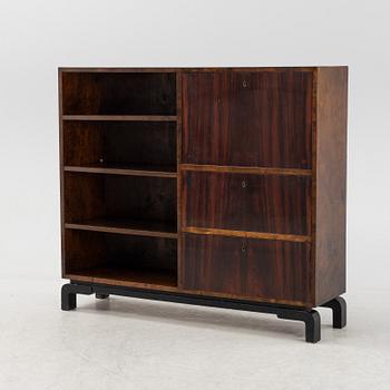 A 1930s stained birch and rosewood secretaire and bookcase.
