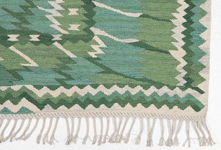 Barbro Nilsson, a carpet, 'Strålblomman grön', tapestry weave, c. 316 x 232 cm, signed AB MMF BN.