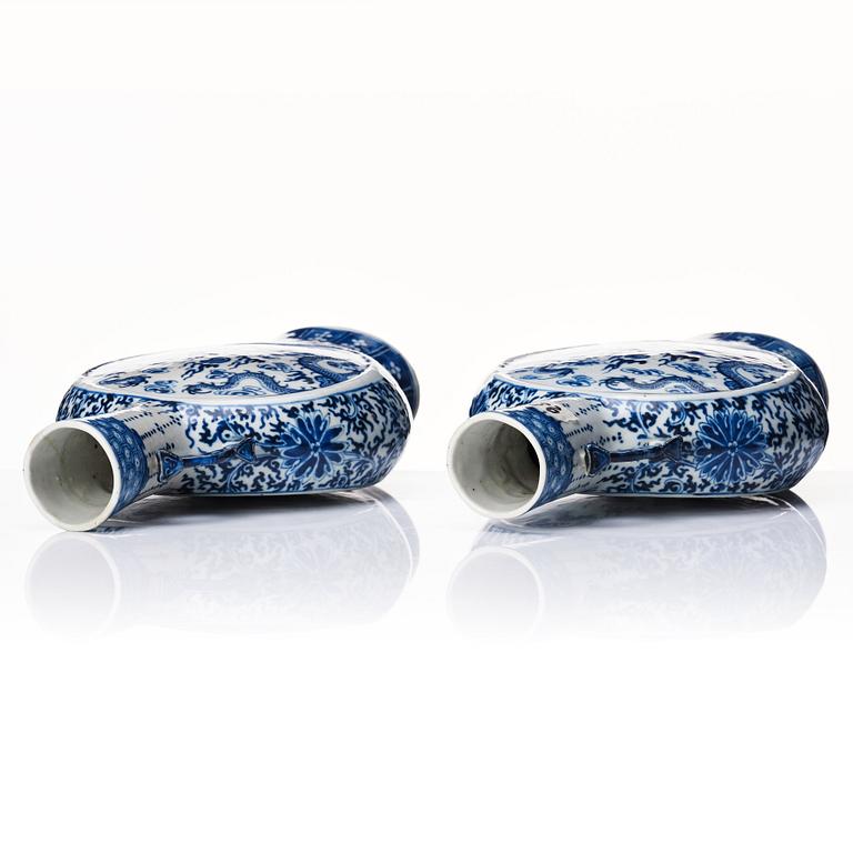 A pair of Chinese blue and white pilgrim vases, Qing dynasty, 19th Century.