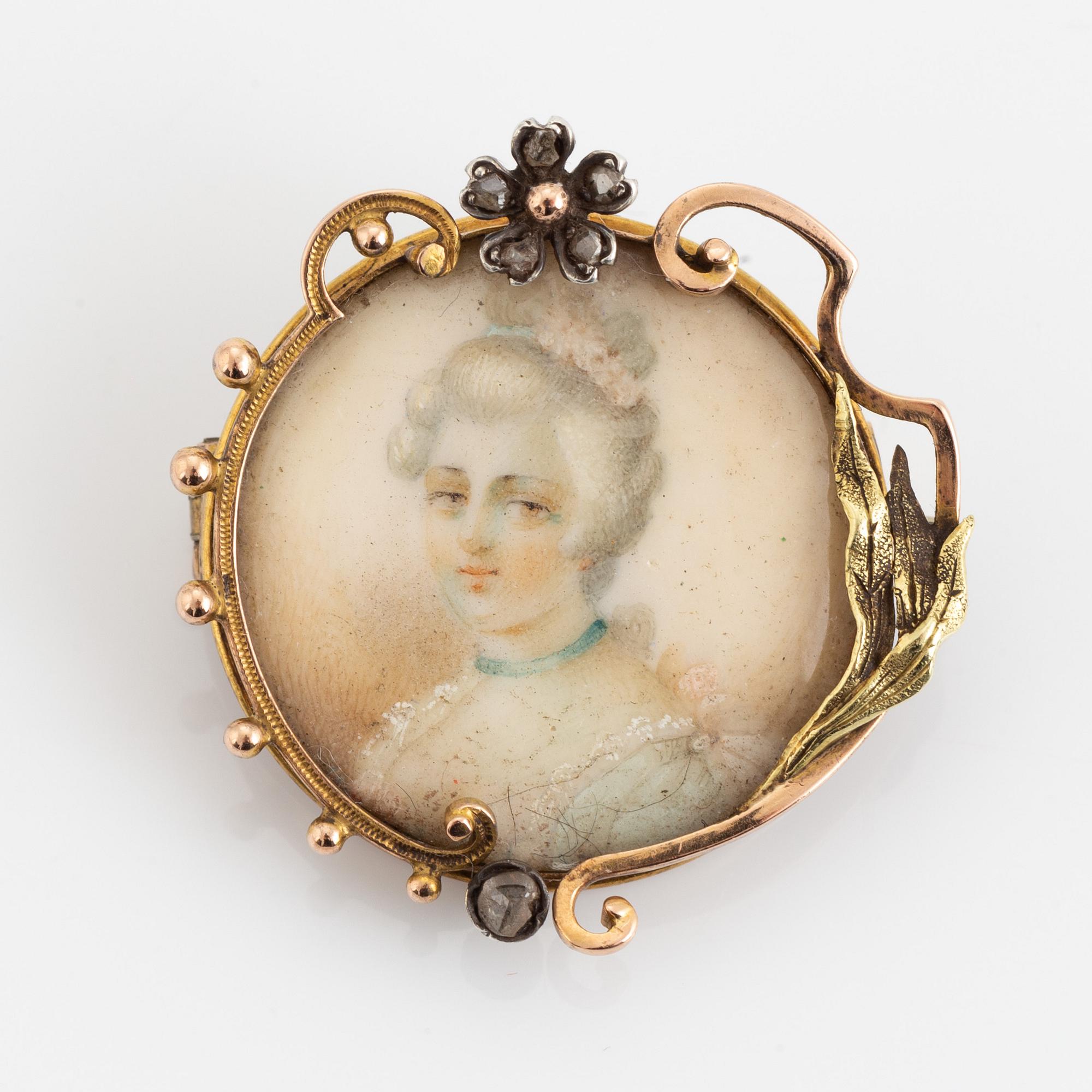 Brosch, 14K guld med miniatyr.