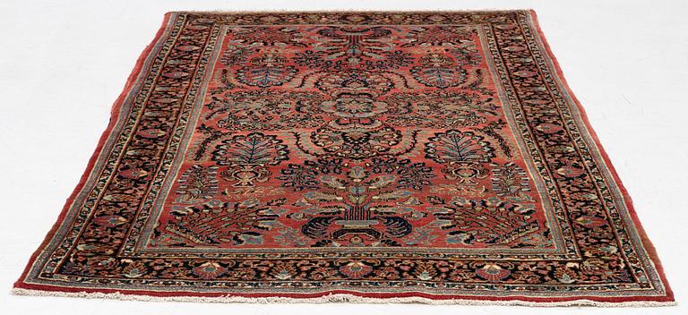 A semi-antique 'Mahajiran' Sarouk carpet, c 275 x 185 cm.