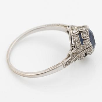 Ring 14K gold with a synthetic blue stone and small diamonds and white stones.