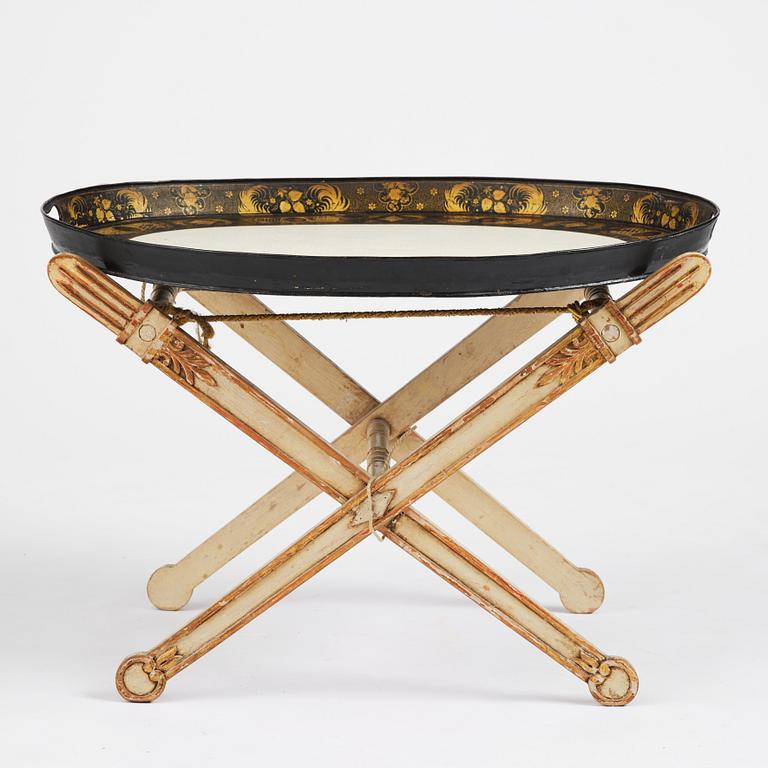 A tole-peinte Empire tray, first part 19th century on a later stand.