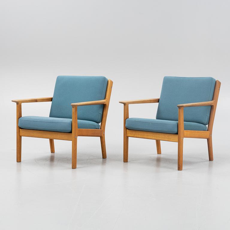 Hans J Wegner, a pair of oak 'GE-265'
easy chairs, Getama, Gedsted, Denmark.
