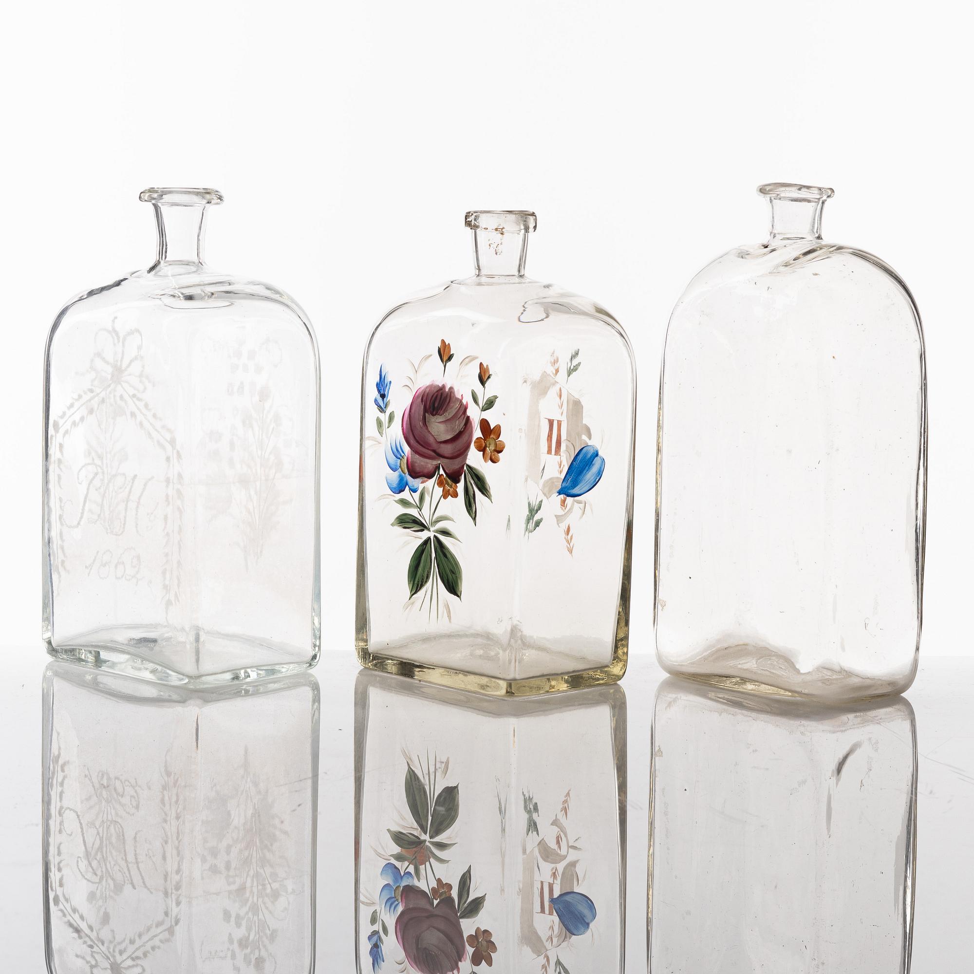A set of seven glass bottles, 19th Century/circa 1900.