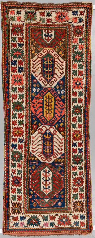 MATTO, a semi-antique Kazak, ca 273-277 x 100-105 cm (as well as ca 2,5 cm flat weave at one end).