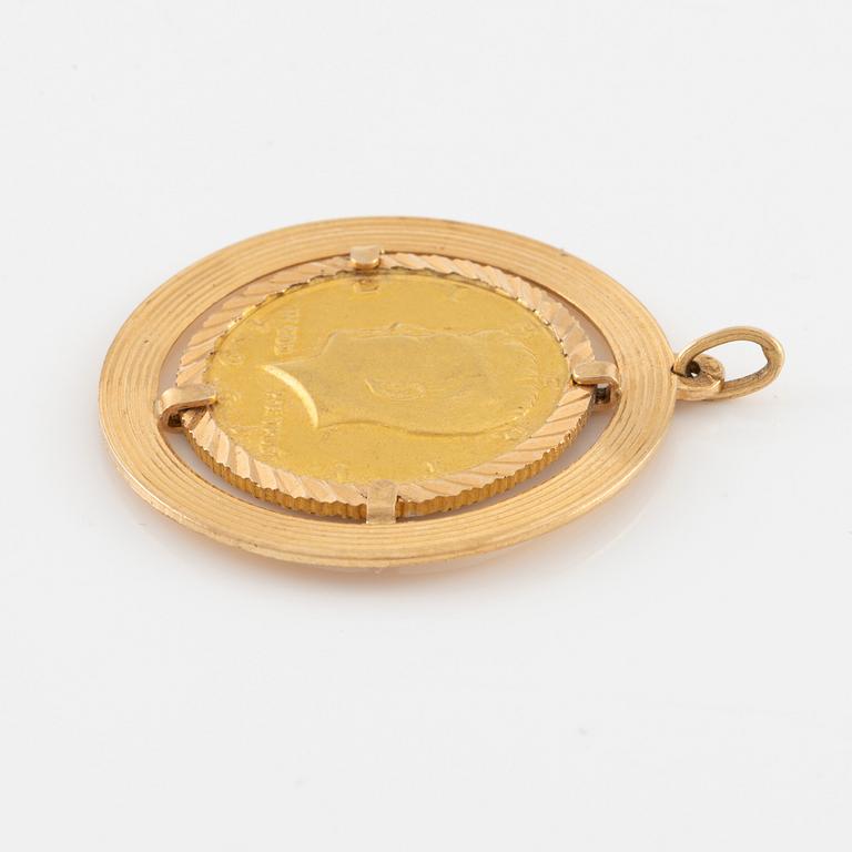 Pendant in 18K gold with gold coin.