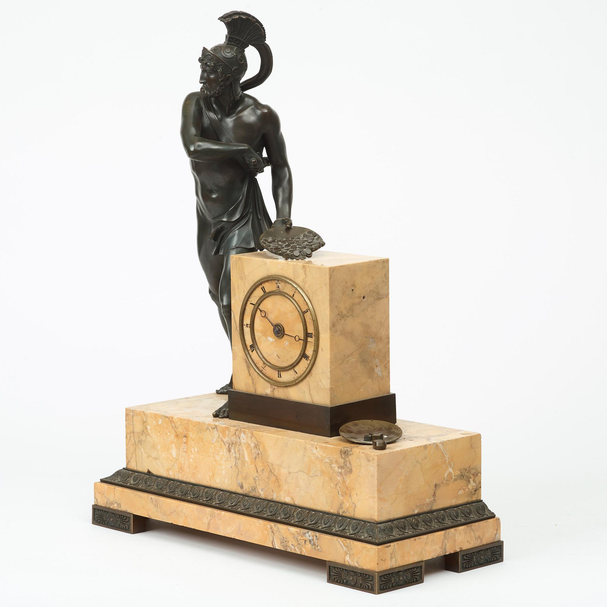 A set of mantel clock and a pair of tazza, French Empire, first half of the 19th century.