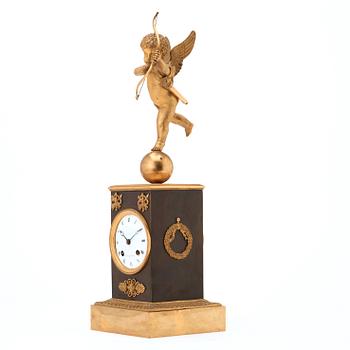 A Swedish Empire gilt and patinated bronze mantel clock by J F Cedergren, clockmaker in Stockholm 1811-1839.